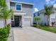 Charming townhome with a private garage, well-manicured landscaping, and a welcoming front entrance at 2882 Suncoast Plains Dr, Odessa, FL 33556
