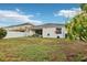 Spacious backyard with a covered patio, perfect for outdoor relaxation and entertainment at 304 Shell Manor Dr, Ruskin, FL 33570