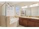 This bathroom features a double sink and soaking tub at 304 Shell Manor Dr, Ruskin, FL 33570