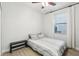 This bedroom features a ceiling fan, lots of light, and warm laminated floors at 304 Shell Manor Dr, Ruskin, FL 33570