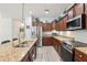 Well-equipped kitchen with stainless steel appliances, granite countertops, and stylish cabinetry at 304 Shell Manor Dr, Ruskin, FL 33570