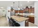 Kitchen island with granite countertops, stainless steel appliances and a breakfast bar at 304 Shell Manor Dr, Ruskin, FL 33570