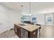 Kitchen island with stainless steel dishwasher, sink and granite countertop at 304 Shell Manor Dr, Ruskin, FL 33570