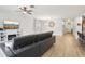A bright and spacious living room featuring a built in fireplace and wood flooring at 304 Shell Manor Dr, Ruskin, FL 33570