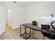 Office features neutral walls, laminate flooring, and views of the hallway at 304 Shell Manor Dr, Ruskin, FL 33570