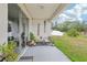 Outdoor patio with decorative accents, seating area, and views of the green lawn at 304 Shell Manor Dr, Ruskin, FL 33570