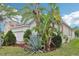 An expansive yard featuring lush greenery, mature trees, and well-kept landscaping at 304 Shell Manor Dr, Ruskin, FL 33570