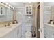 Well-lit bathroom featuring a shower, storage cabinet, and updated vanity at 31 Island Way # 505, Clearwater Beach, FL 33767