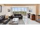 Inviting living room with expansive windows framing breathtaking waterfront vistas at 31 Island Way # 505, Clearwater Beach, FL 33767