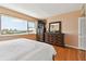 A bright main bedroom featuring city views and wood floors at 31 Island Way # 505, Clearwater Beach, FL 33767