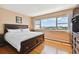 A sunlit main bedroom featuring views and dark wood furniture at 31 Island Way # 505, Clearwater Beach, FL 33767