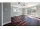 Bedroom with wood floors, neutral paint and sliding doors to an outdoor deck at 3212 W Arch St, Tampa, FL 33607