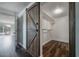 Spacious closet with built-in shelving, stylish barn door, and hardwood floors at 3212 W Arch St, Tampa, FL 33607