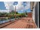 Large wooden deck with railing and view of backyard landscaping at 3212 W Arch St, Tampa, FL 33607