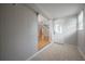 Bright entryway featuring tile floors, access to the living area, and a white front door at 3212 W Arch St, Tampa, FL 33607