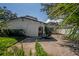 Exterior side and backyard view of home with partial shade from palm tree at 3212 W Arch St, Tampa, FL 33607