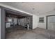 The garage features neutral paint, a utility sink, and shelving and storage at 3212 W Arch St, Tampa, FL 33607
