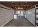 The garage features unfinished ceiling and storage, plus washer and utility sink at 3212 W Arch St, Tampa, FL 33607