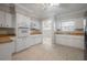 Bright kitchen features updated white cabinetry and modern appliances at 3212 W Arch St, Tampa, FL 33607