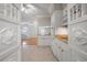 Bright, modern kitchen with white cabinets, wood countertops, and tile floors at 3212 W Arch St, Tampa, FL 33607