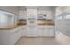 Bright kitchen features white cabinetry and modern appliances at 3212 W Arch St, Tampa, FL 33607