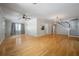 Bright living area with hardwood floors, large windows, and stairs to the second floor at 3212 W Arch St, Tampa, FL 33607