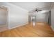 Hardwood floors in a brightly lit living room featuring access to the dining room at 3212 W Arch St, Tampa, FL 33607