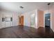 Spacious primary bedroom features hardwood floors, built-in storage, and access to a walk-in closet and attached bath at 3212 W Arch St, Tampa, FL 33607
