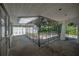 Rear patio featuring ironwork, access to rear and front of property, and access to backyard at 3212 W Arch St, Tampa, FL 33607