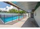 Backyard pool featuring a covered patio area for relaxing and enjoying the outdoors at 3212 W Arch St, Tampa, FL 33607