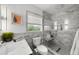 Luxurious bathroom with gray marble walls, walk-in shower, window and modern toilet at 3505 W Kensington Ave, Tampa, FL 33629