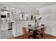Bright dining area with glass table, modern pendant light, and charming decor at 3505 W Kensington Ave, Tampa, FL 33629