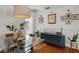 Dining area featuring modern sideboard, art, and glass table at 3505 W Kensington Ave, Tampa, FL 33629