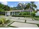 Well-maintained single story home with modern driveway, mature trees, and manicured landscaping at 3505 W Kensington Ave, Tampa, FL 33629