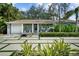 Charming home with modern driveway, manicured landscaping, and a covered front porch at 3505 W Kensington Ave, Tampa, FL 33629