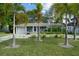 Attractive single-story home featuring a well-manicured lawn and modern driveway with grass accents at 3505 W Kensington Ave, Tampa, FL 33629