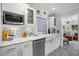Bright kitchen featuring white cabinets, marble counters, stainless steel appliances and patterned floors at 3505 W Kensington Ave, Tampa, FL 33629