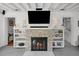 Living room with stone fireplace and white built-ins at 3505 W Kensington Ave, Tampa, FL 33629