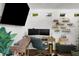 Bright home office features dual monitors, modern desk, and ample storage, creating a functional and stylish workspace at 3505 W Kensington Ave, Tampa, FL 33629