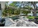 Relaxing backyard featuring a private pool and spa surrounded by lush landscaping and a serene outdoor ambiance at 3505 W Kensington Ave, Tampa, FL 33629