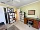 A versatile bedroom with desk, storage shelves, and natural lighting at 3890 Mainlands N Blvd, Pinellas Park, FL 33782