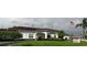 Mainlands 3 clubhouse, a welcoming community center with well-kept landscaping and a clear American flag at 3890 Mainlands N Blvd, Pinellas Park, FL 33782