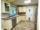 Well-equipped kitchen with a stainless steel refrigerator and plenty of storage space at 3890 Mainlands N Blvd, Pinellas Park, FL 33782