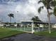 Community shuffleboard courts nestled among palm trees, offering a recreational amenity for residents at 3890 Mainlands N Blvd, Pinellas Park, FL 33782