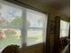 Bright water views seen through window blinds with draperies at 3890 Mainlands N Blvd, Pinellas Park, FL 33782