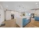 Bright, modern kitchen with a large island, pendant lighting, and stainless steel appliances at 3910 Doral Dr, Tampa, FL 33634