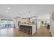 Bright, open kitchen with a large island, stainless steel appliances, pendant lighting, and access to the backyard at 3910 Doral Dr, Tampa, FL 33634