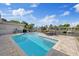 Backyard pool with brick pavers, canal view, and lounge chairs at 3910 Doral Dr, Tampa, FL 33634