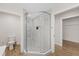 A modern shower with frameless glass enclosure, marble tile, and built-in niche at 3910 Doral Dr, Tampa, FL 33634