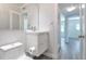 Bathroom with modern sink and a hallway leading to the living room at 4001 W North A St, Tampa, FL 33609